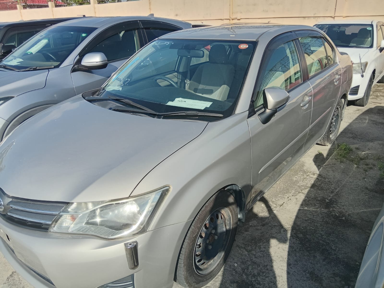 2013 Toyota Axio for Sale in Guyana – Gold/ Silver – Ref 13063